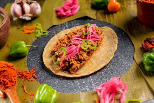 Cochinita pibil Taco with condiments