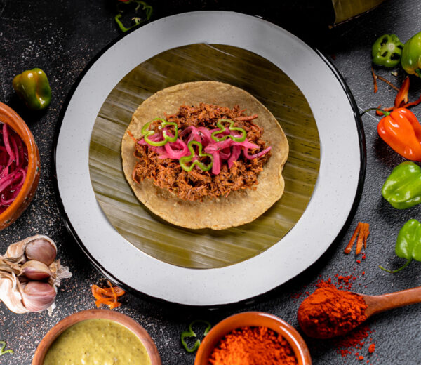 Cochinita pibil Taco with condiments